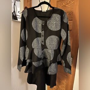 Belmont peplum style jacket, longer in the‎ back.